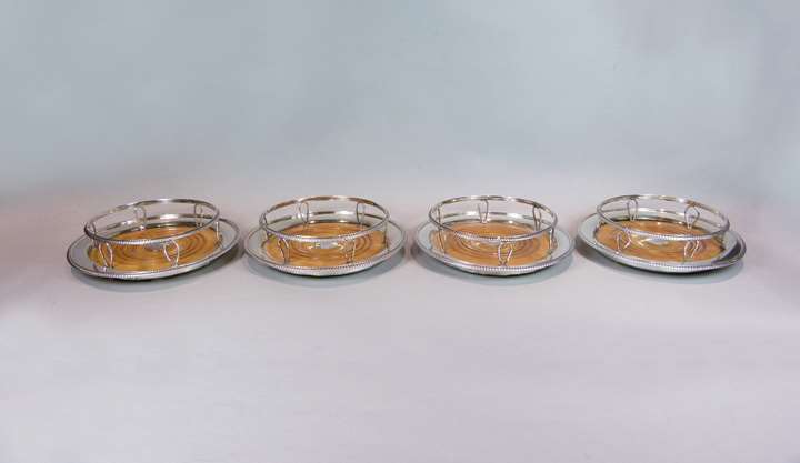 Set of four George III silver wine coasters